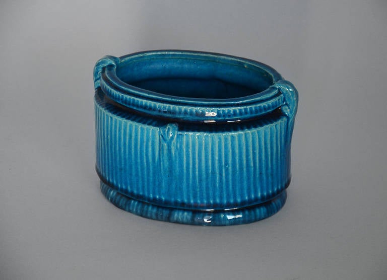 Oval vase in earthenware with turquoise blue glaze. Manufactured by Kähler in Næstved. Signed SH HAK Danmark.

We ship this item worldwide, please write to contact@apetersen.dk for shipping options and prices.