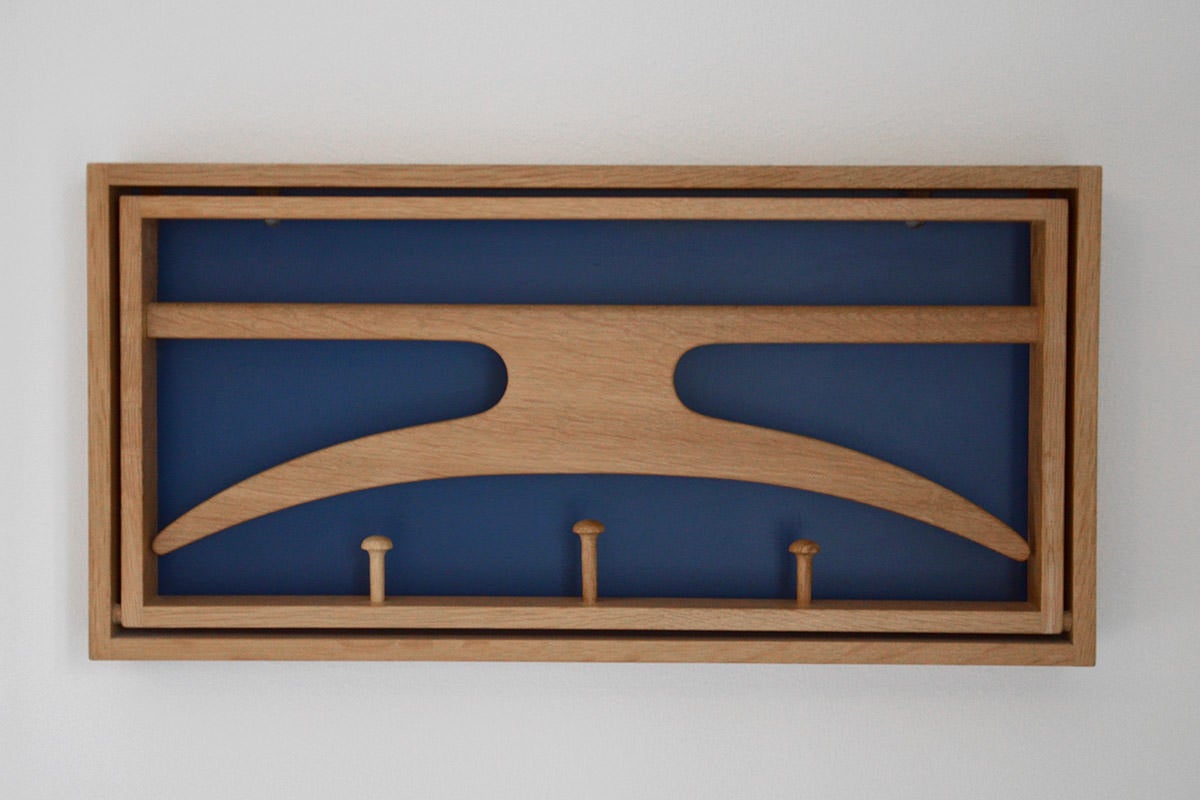 Coat rack in oak with foldable hanger. Blue varnished back plate. Manufactured by Virum Møbelsnedkeri v/Rasmussen og Brygger. Depth is 29 cm when opened.

We ship this item worldwide, please write to contact@apetersen.dk for shipping options and