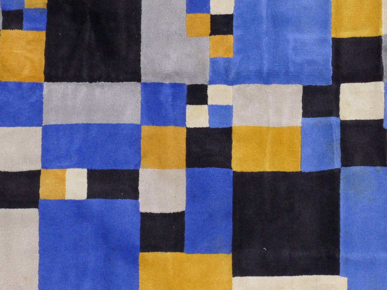 Artist: After Sonia Delaunay. 
Dimensions: 285 x 177 cm.
Beautiful blue and yellow geometrical composition. 
The rug is signed in the weave at the lower left corner 