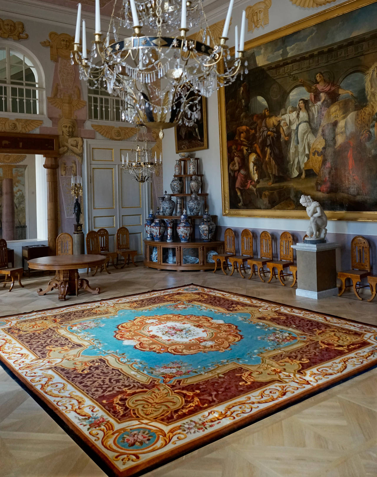 It is a rare Napoléon III Aubusson rug from the 19th Century in perfect conditions. 

Dimensions: 500 x 440 cm.
Composition: Wool
Manufacture Royale - Aubusson 
Hand-knotted
19th Century

Provenance: Aristocratic family

Workshops to