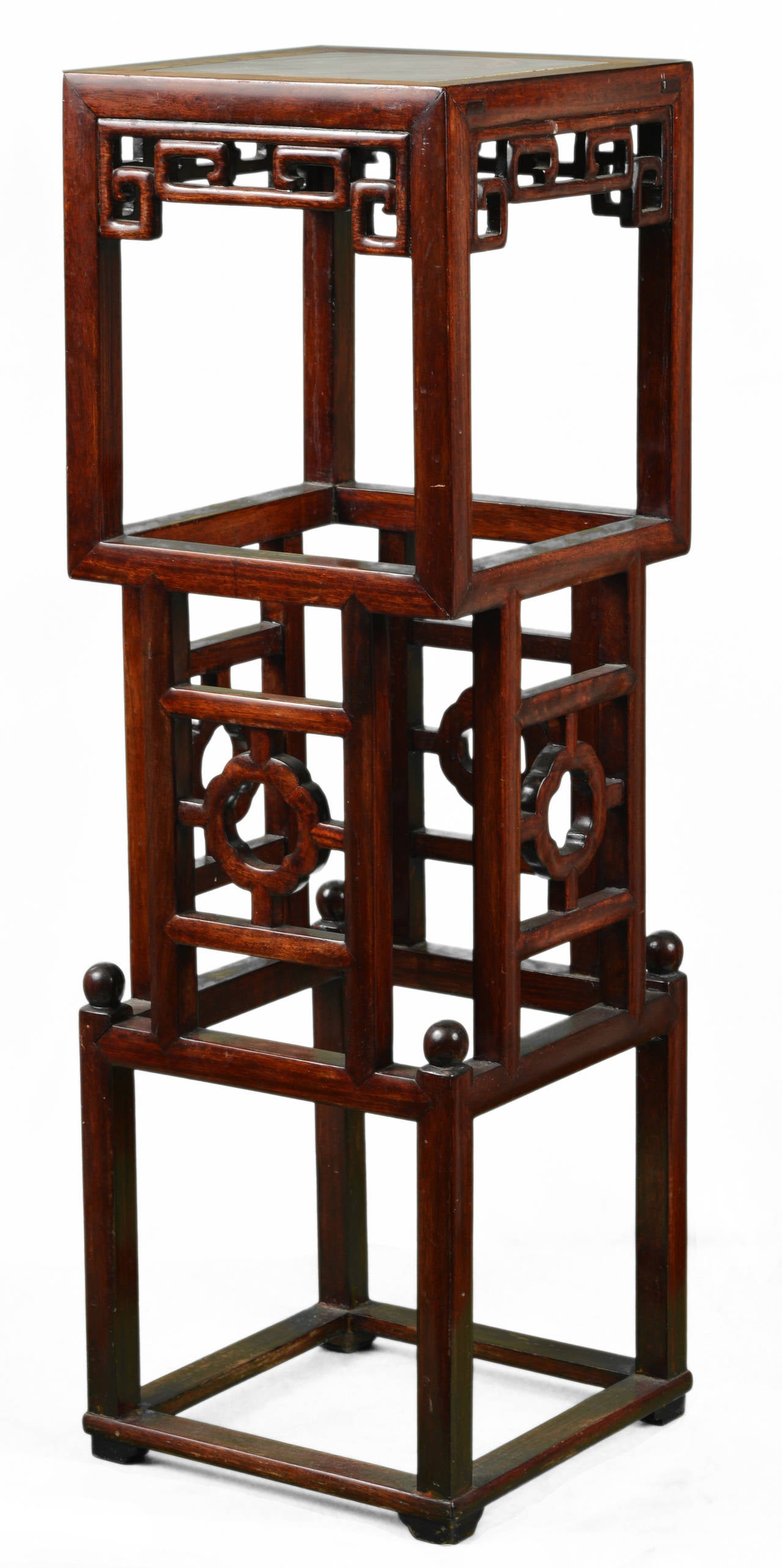 Chinese square plant Stand.
Comprising three overlapping open cages.
Marble top.

Pierced lattice of Chinese key motif on all sides of the skirt.
19th century.
Height 84.8 cm (33