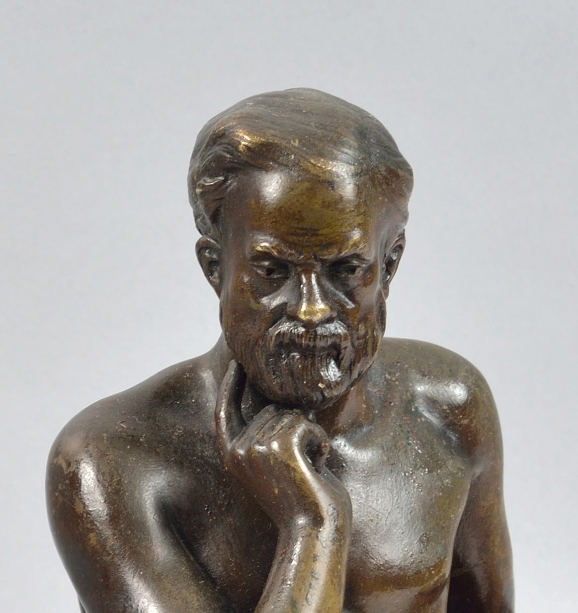 Edouard Drouot.
French, 1859-1945.
Seated philosopher.
Bronze, dark brown patina.
Signed E. Drouot, with founder stamp Etling Paris.
Raised on a marble base with flat back to fit against a vertical surface.
Height 25 cm.