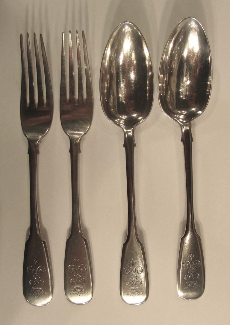 Russian silver four-piece part-table service of cutlery.
Two table spoons and two table forks.
Each engraved with family crest.
Fiddle-pattern.
Stamped silver hallmarks kokoshnik 84 (875/1000 purity degree).
Mark of Karl Fabergé.
Assayer's