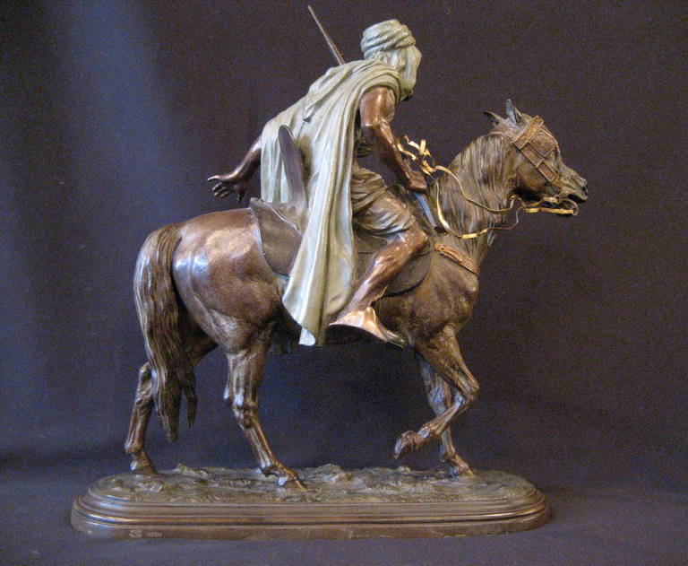 An Arab warrior on horseback.
Bronze with green, brown and gold patina.
Signed 