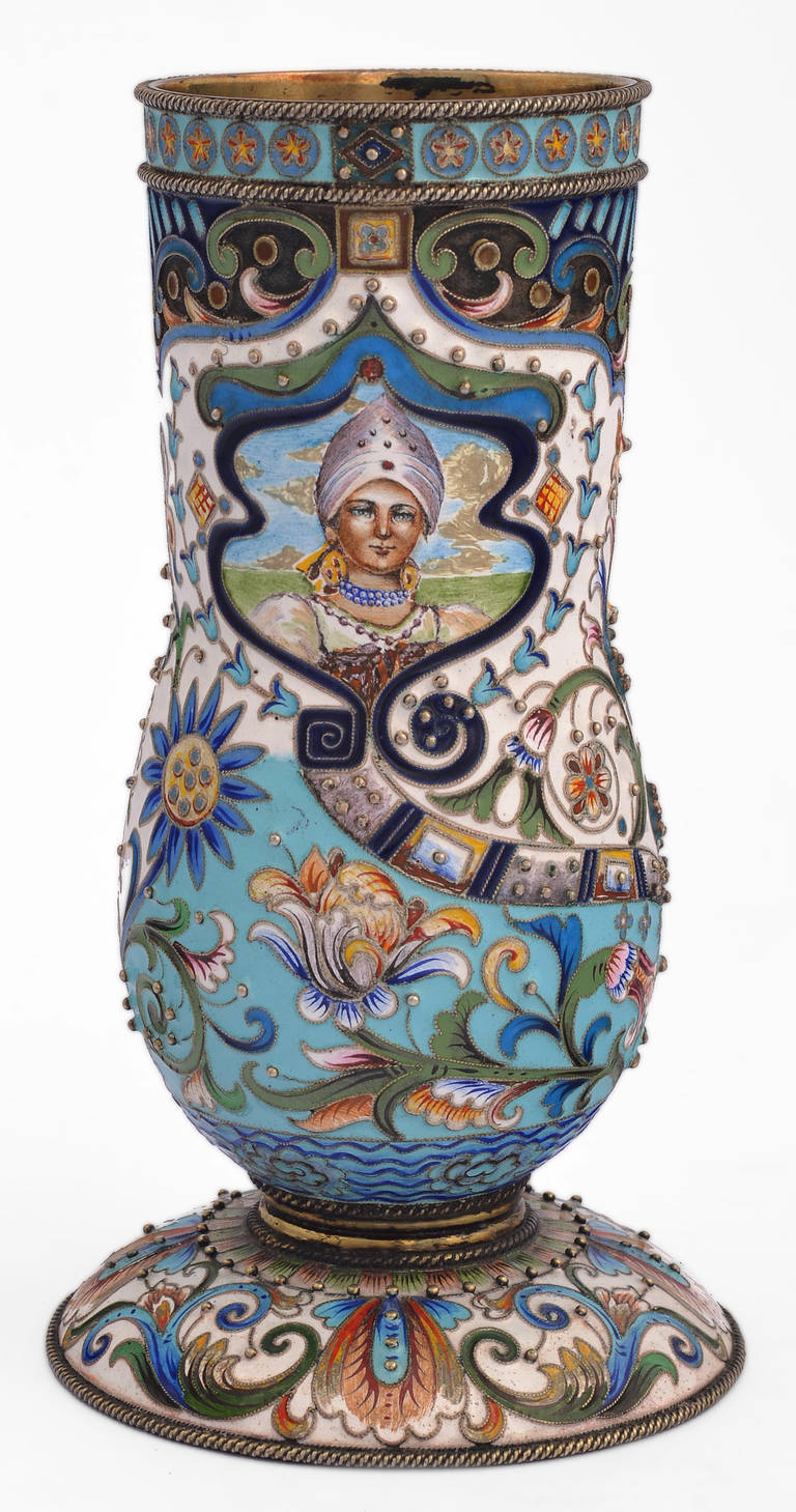 Russian vase.
Gilded silver and cloisonné enamel vase in the old Russian style.
Decorated one side with a painted enameled miniature of a Russian maiden.
Bearing the marks of Feodor Rückert (1840-1917) and not by the hand of the artist.
circa