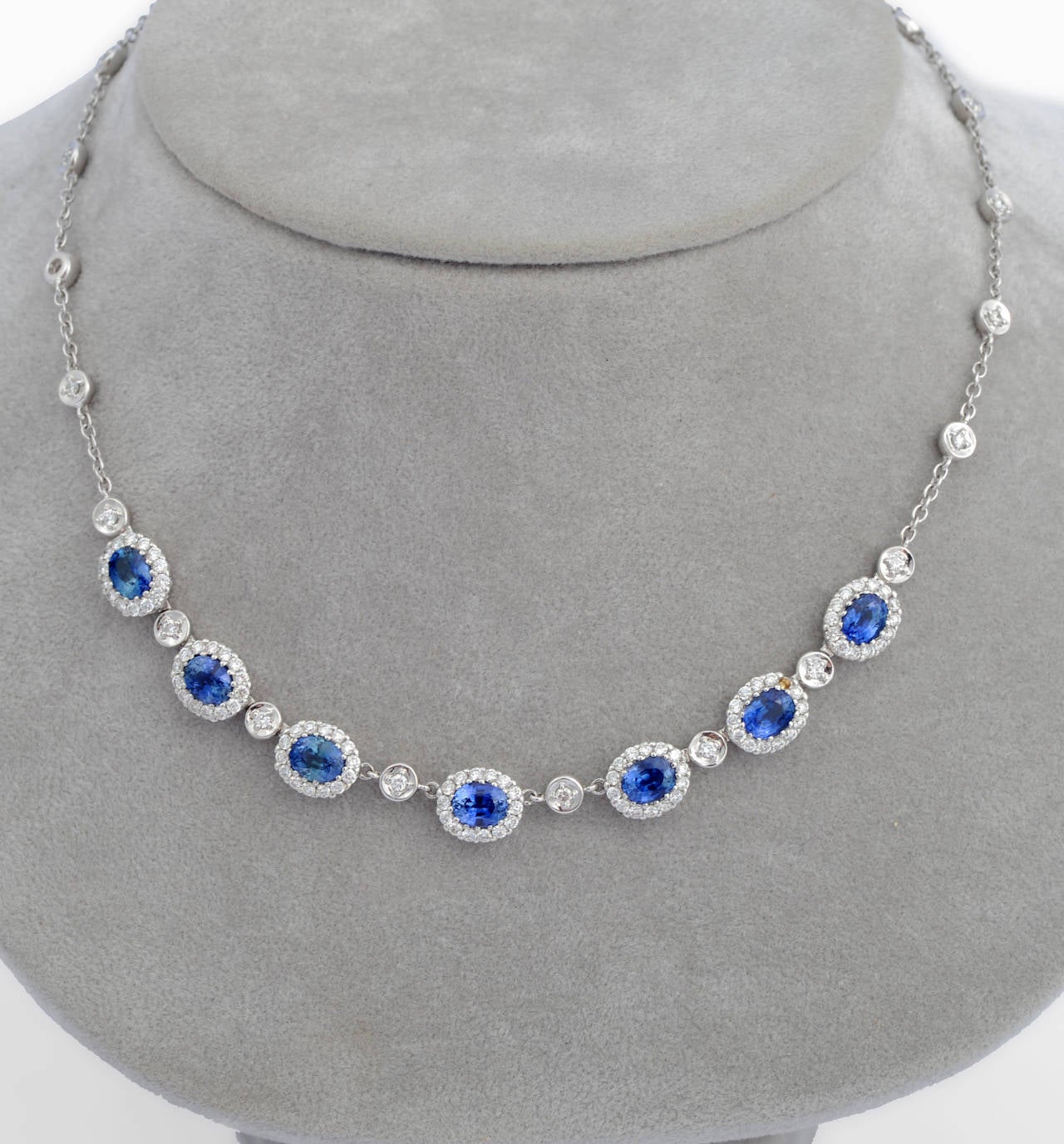 The delicate chain set with alternating diamonds and sapphires.
Ceylon sapphires of homogeneous kingly blue color and exceptional clarity, weighing 3.43-carats.
Excellent quality circular-cut and brilliant-cut diamonds together weighing
