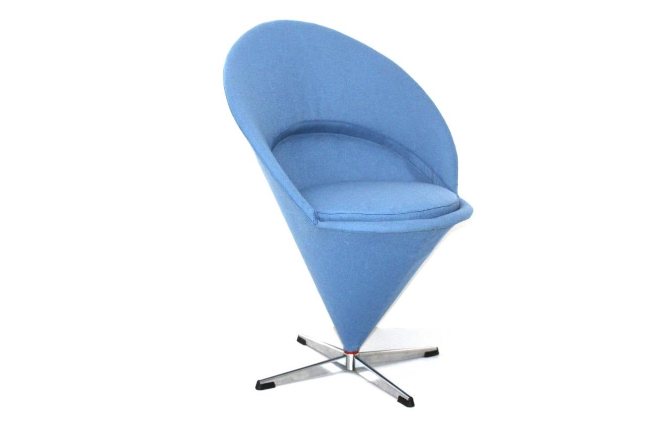 Blue Scandinavian Modern cone chair or side chair by Verner Panton 1958 and executed by Gebr. Nehl, Germany. 
The cone swiveling body was made of steel and is fixed on a chromed steel cross base.
Renewed upholstery and covered with textile fabric in