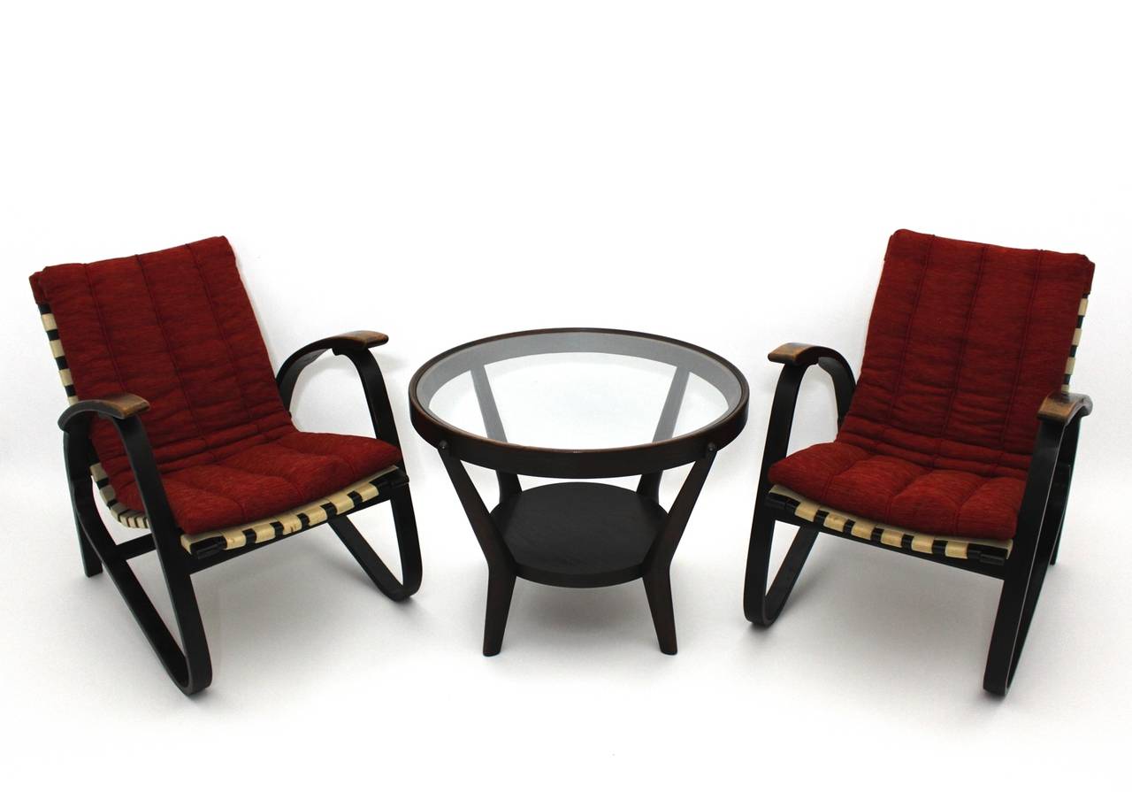 Art Deco vintage lounge chairs designed by Jan Vanek (1891-1962) and produced by UP Zavodny.
The bentwood beech frame is in original vintage condition. 
The original upholstery is covered with renewed red wool fabric coat and so the condition is
