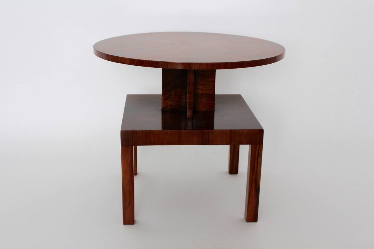 This elegant viennese coffee table has two-tiers. The first tier has a round plate and the second tier has a rectangular plate.
This form reflects the taste and printout of the 1930s.

The table is designed and produced from the viennese