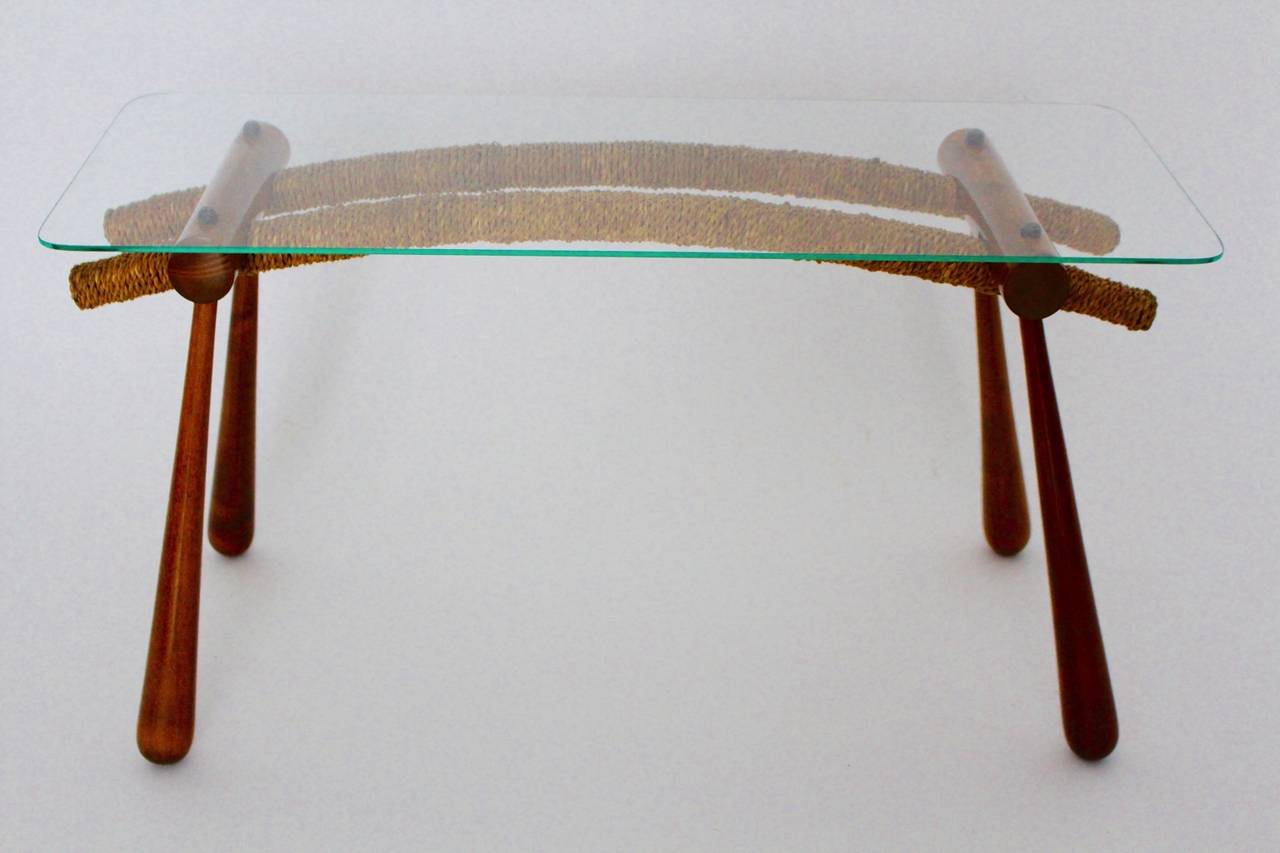 Mid Century Modern vintage organic coffee table or side table from maple by Max Kment for Kunstgewerbliche Werkstätten Max Kment, 1950s Vienna.
A wonderful side table or sofa table from maple tree and cord with clear glass plate by Max Kment 1950s