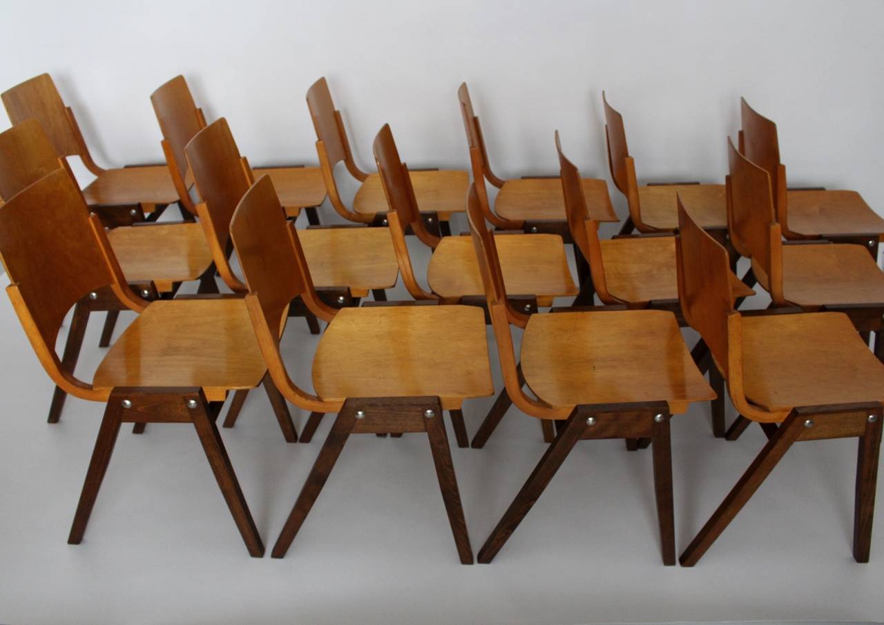 Mid Century Modern Dining Room Chairs model P7 , which were designed by Roland Rainer for the Viennese city hall 1952 for the stage area.
The Dining Room Chairs were executed by Emil & Alfred Pollak, Vienna and were made of brown stained solid