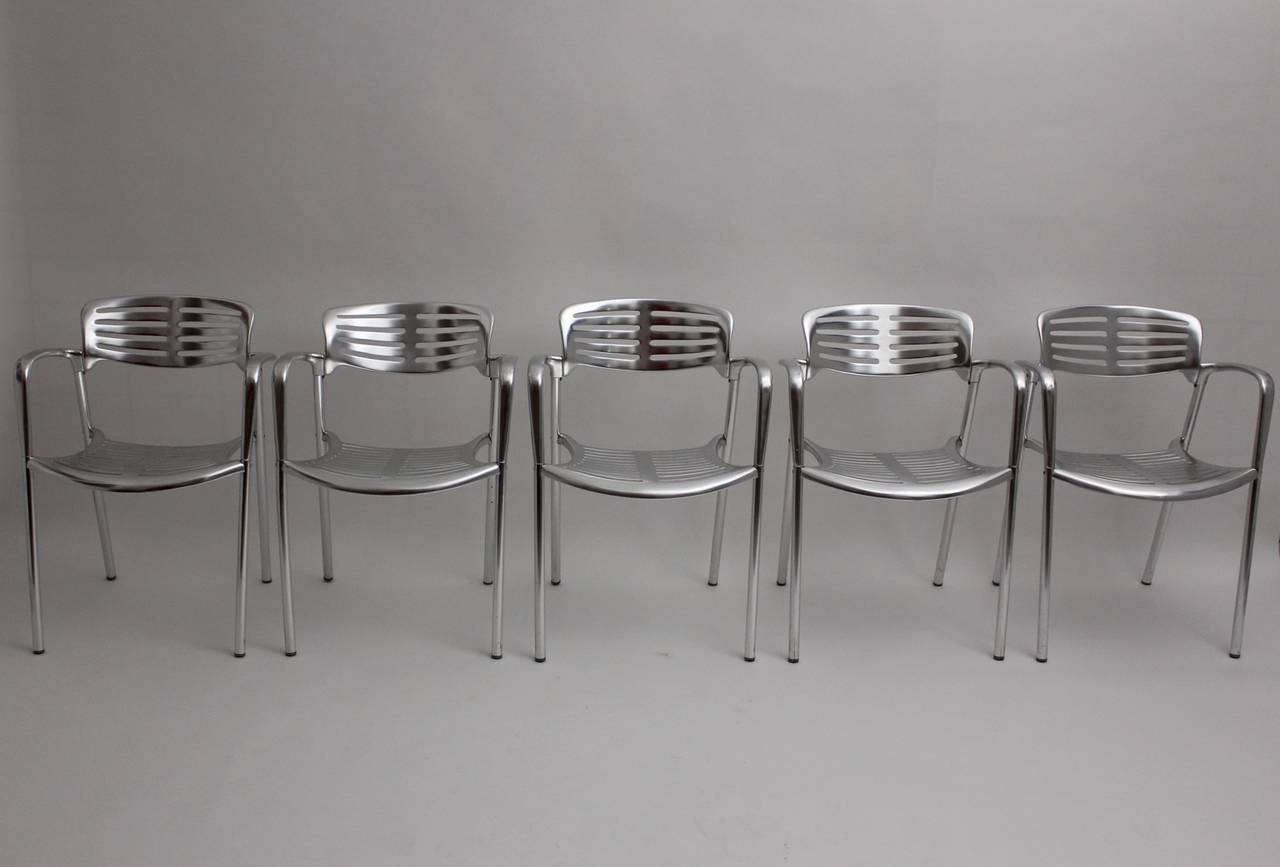 Postmodern vintage set of five aluminum stacking dining chairs patio chairs designed by Jorge Pensi, 1986-1988, and produced by Amat-3. Provide with the stamp 