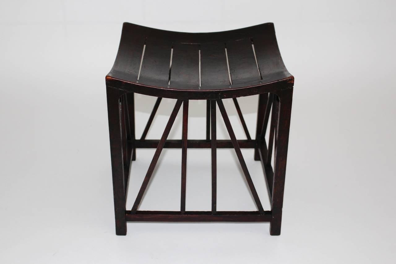 Vintage oakwood Thebes stool handmade in Arts & Craft tradition, which was made c. 1910 attributed to Liberty & Co, UK.
An earlier model of this presented stool is shown at the exhibition in the British Museum in London and was designed and