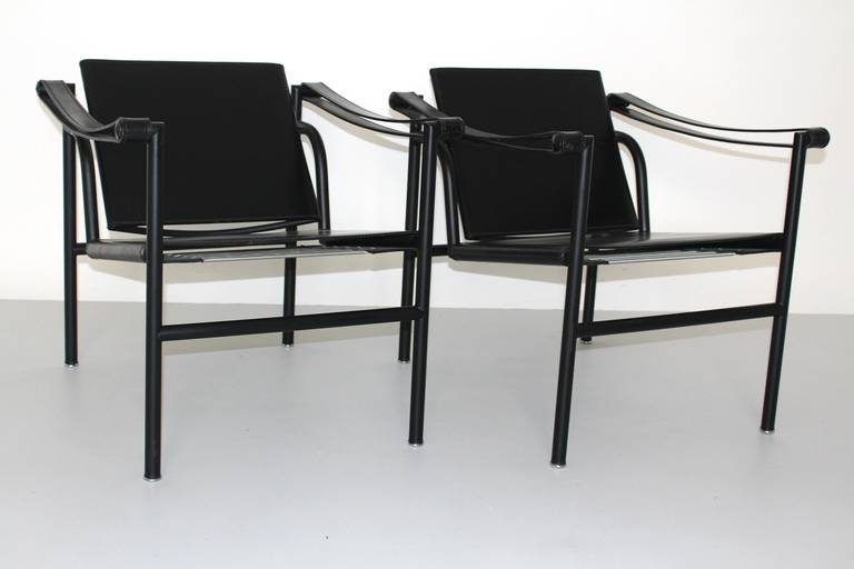 Black lacquered tabular steel, black leather seat and backrest, widened leather arm slings.
Designed by Le Corbusier, Pierre Jeanneret,Charlotte Perriand 1928

Both chairs are executed 1980 by Cassina, Italy, and numbered with cassina product