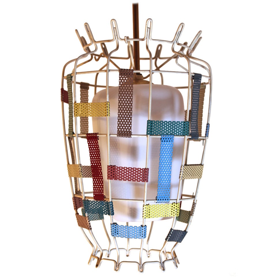 Mid-century modern vintage chandelier or pendant style Mathieu Matégot, from multicolored metal and milk glass, France 1950s. 
A playful chandelier with a white lacquered metal basket and fixed multicolored perforated metal plates, while an original