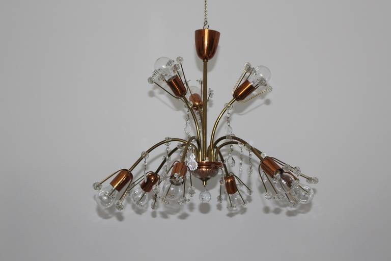Mid century modern vintage chandelier from copper and brass combination designed by Emil Stejnar in Vienna circa 1950.
An amazing chandelier with many cute flowers and cute crystal globes elements.
Nine arms with nine sockets E 27
It is possible to