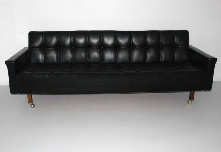 Early daybed designed by Viennese architect Johannes Spalt and executed by Franz Wittmann, Austria, circa 1959
Very easy to open with one hand and to change the settee into a daybed.
The daybed has a black leather cover, while the feet were made of