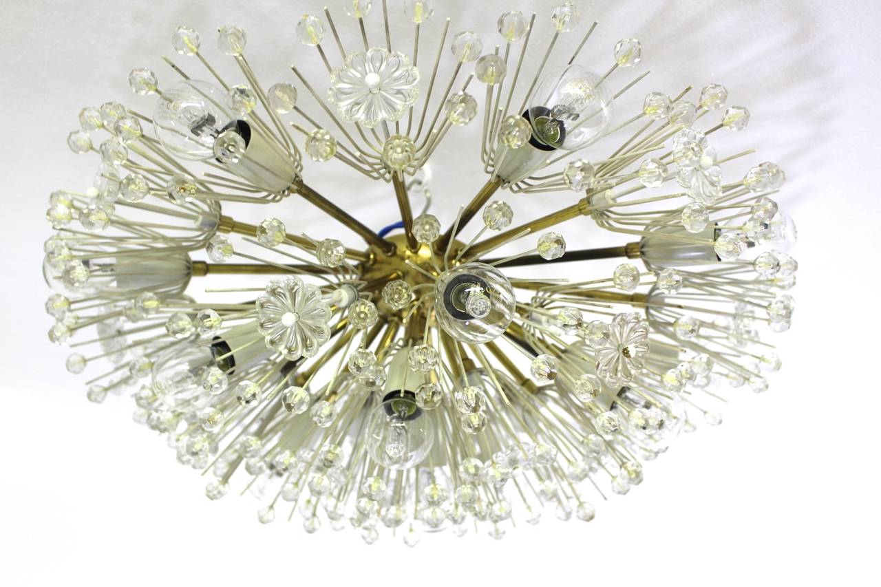 Emil Stejnar brass and glass flush mount executed by the manufacturer Rupert Nikoll, Vienna.
Fifteen bulbs E 14
Magnificent flush mount with lucite flowers and crystals in a very good condition.