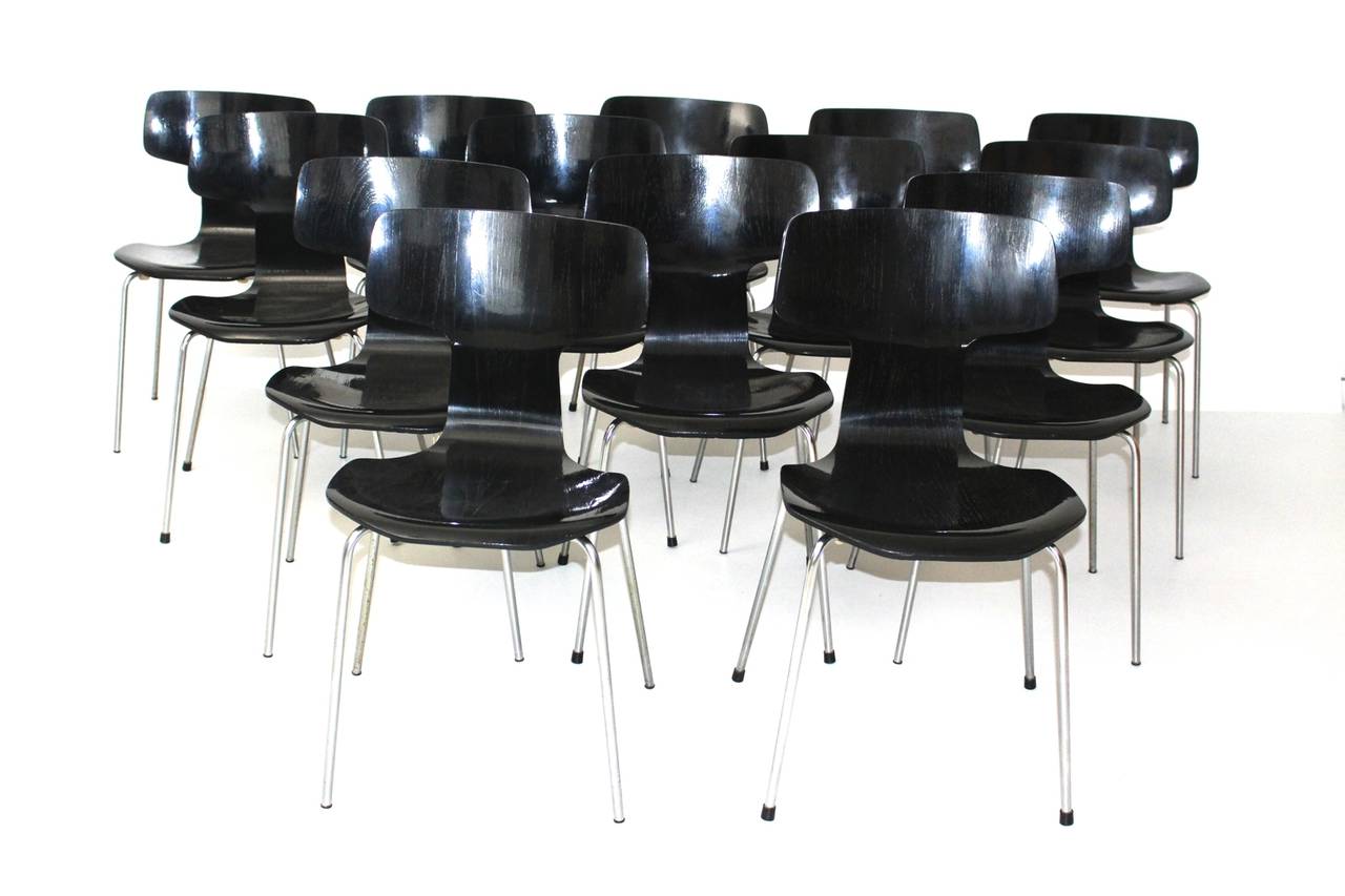 Scandinavian Modern black vintage stacking chairs dining chairs up to 10 pieces of the popular model no.3103 designed by Arne Jacobsen, 1952 and executed by Fritz Hansen, 1970, Denmark.
Up to 10 pieces are available.
Good vintage condition with