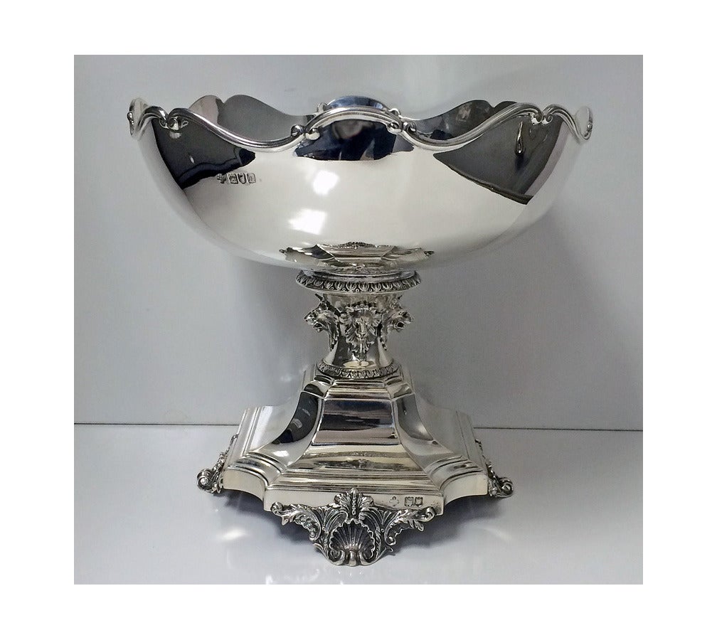 Silver Rose Bowl Centrepiece, London 1903, Henry Wilkinson & Co. The Bowl with wavy rim on pedestal applied with four lion masks, raised on octagonal base with shell and foliate feet Diameter: 8 inches. Height: 7.5 inches. Weight: 24.5 oz.