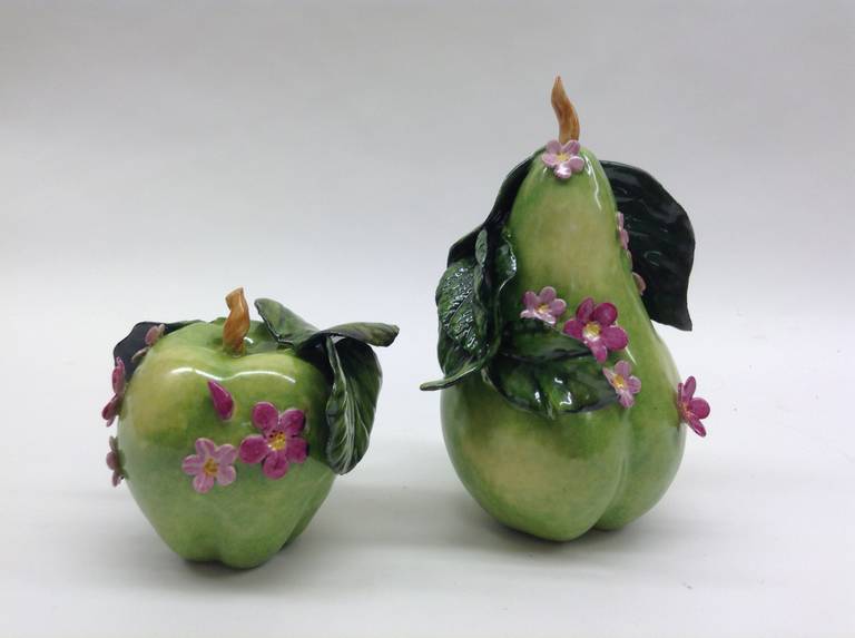 Pair of apple and pear 
Green pear embellished with pink blossoms, 7H x 5W
 Green apple embellished with pink blossoms, 4Hx4W
This is a one of a kind handcrafted piece .

Katherine Houston is a living artist working in an 18th century