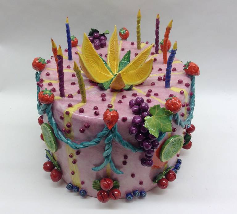 large pink cake surrounded with multiple fruits and ribbons and fanciful colors. This is a one of a kind handcrafted piece.
  
Katherine Houston is a living artist working in an 18th century technique, adapting the techniques and masterful
