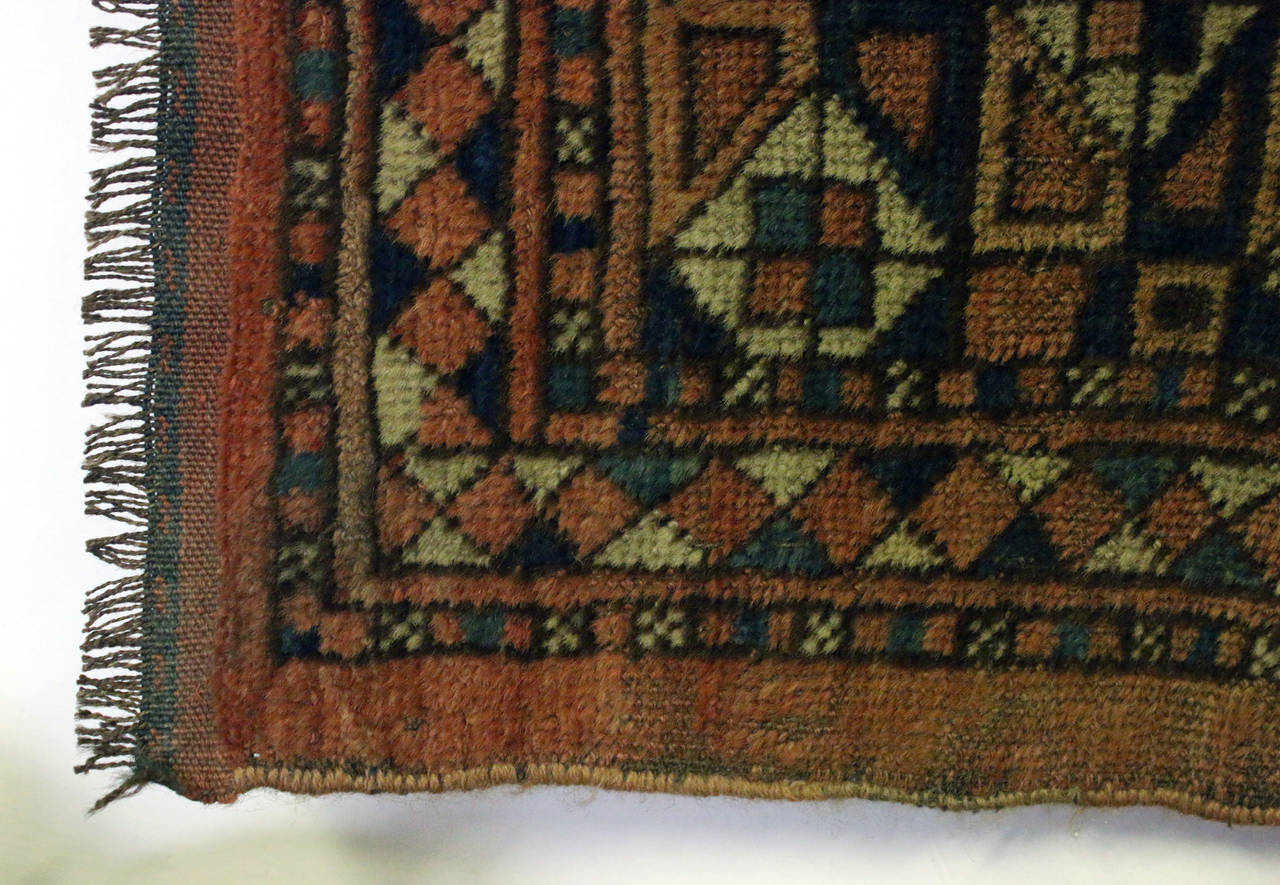 Late 19th century Turkoman Yomut hand-knotted bag face.
A bag face is the front panel of a bag woven by various nomadic tribes of the Middle East and Central Asia for utilitarian and decorative purposes. See measurements below.