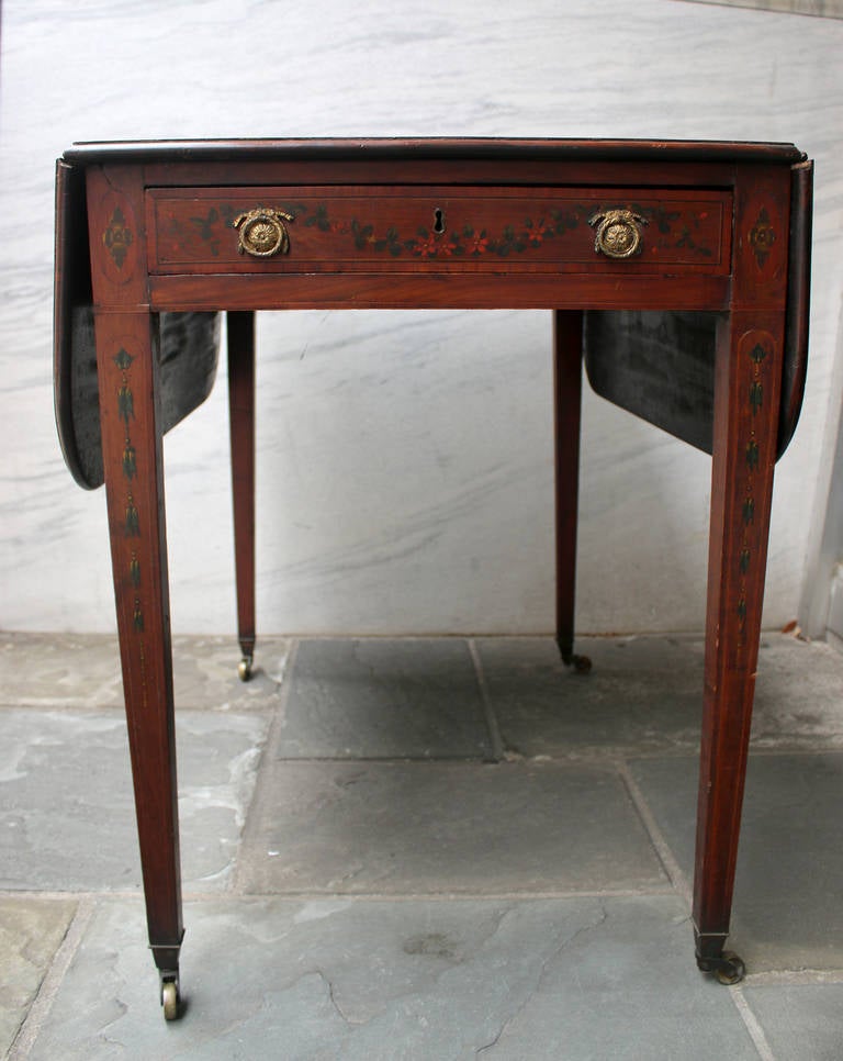 Pembroke table with label from the firm Edwards and Roberts, 1850s, London. We think by the construction it could be made earlier, but sold by this firm. Mahogany with inlay, featuring decorative painting throughout attributed to the style of