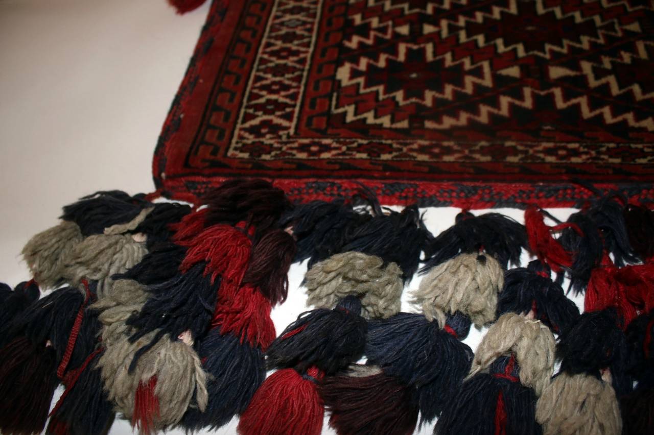 Rare Turkoman hand-knotted decorative asmalyk which is a camel trapping used in weddings.
Measures: 31 inches tall to end of tassels. See other measurements below.