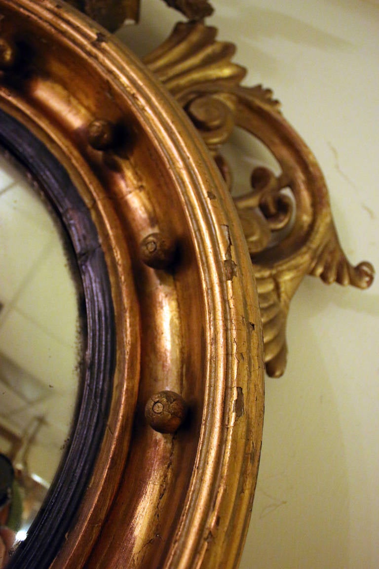 19th Century 19th century American Bull's Eye Convex Giltwood Mirror with Eagle