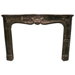 Antique French Louis XV Style Fireplace Mantel in Black and White Fossil Marble