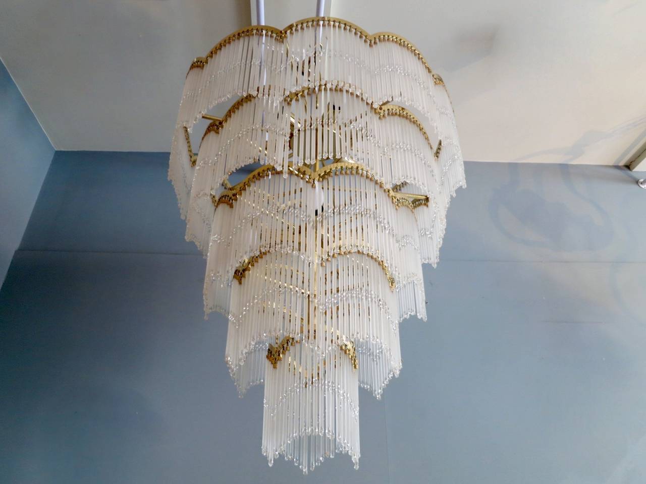 A very decorative waterfall style chandelier dating from the 70's, with 5 tiers of frosted and clear glass twist drops.  
Drop with chain 110cm