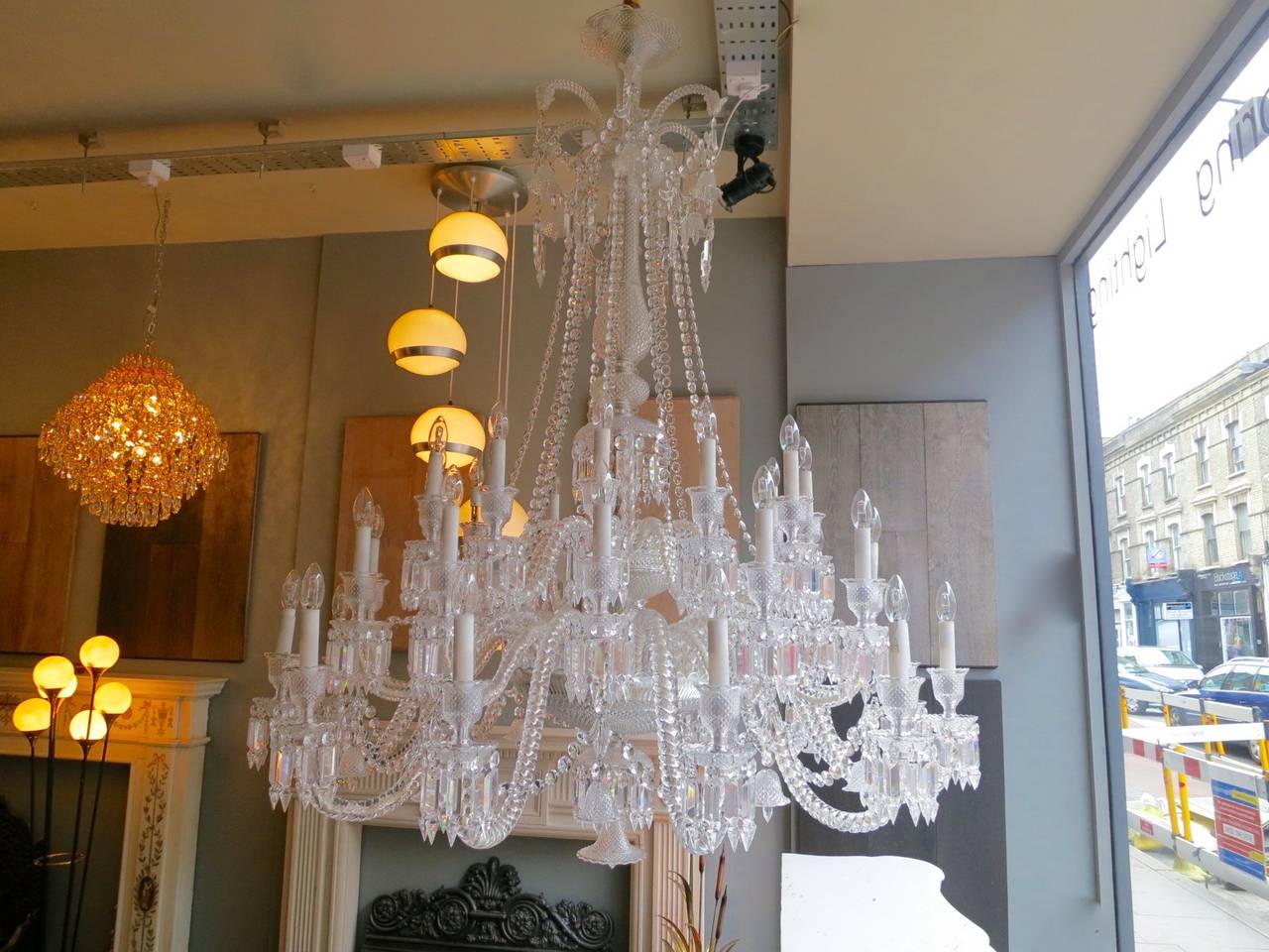 A large 36-arm Crystal chandelier designed by Philippe Starck for Baccarat Paris. Zenith Comete Model. Removed  from Ancaster House, Mayfair London. Former residence of Prince Jefri of Brunei, interior designed by Versace. 3 pairs of wall lights