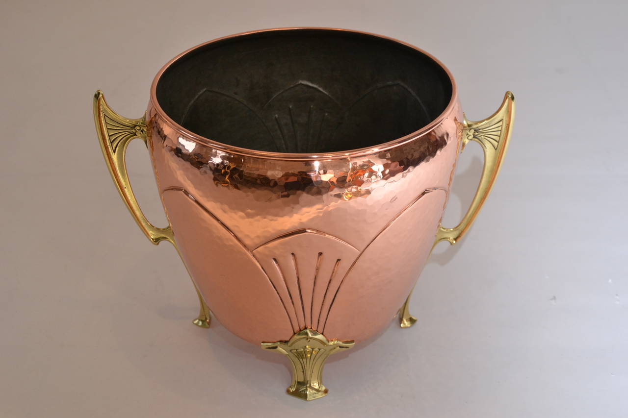 Palm Pot cooper and brass hammered
polished and stove enamelled
