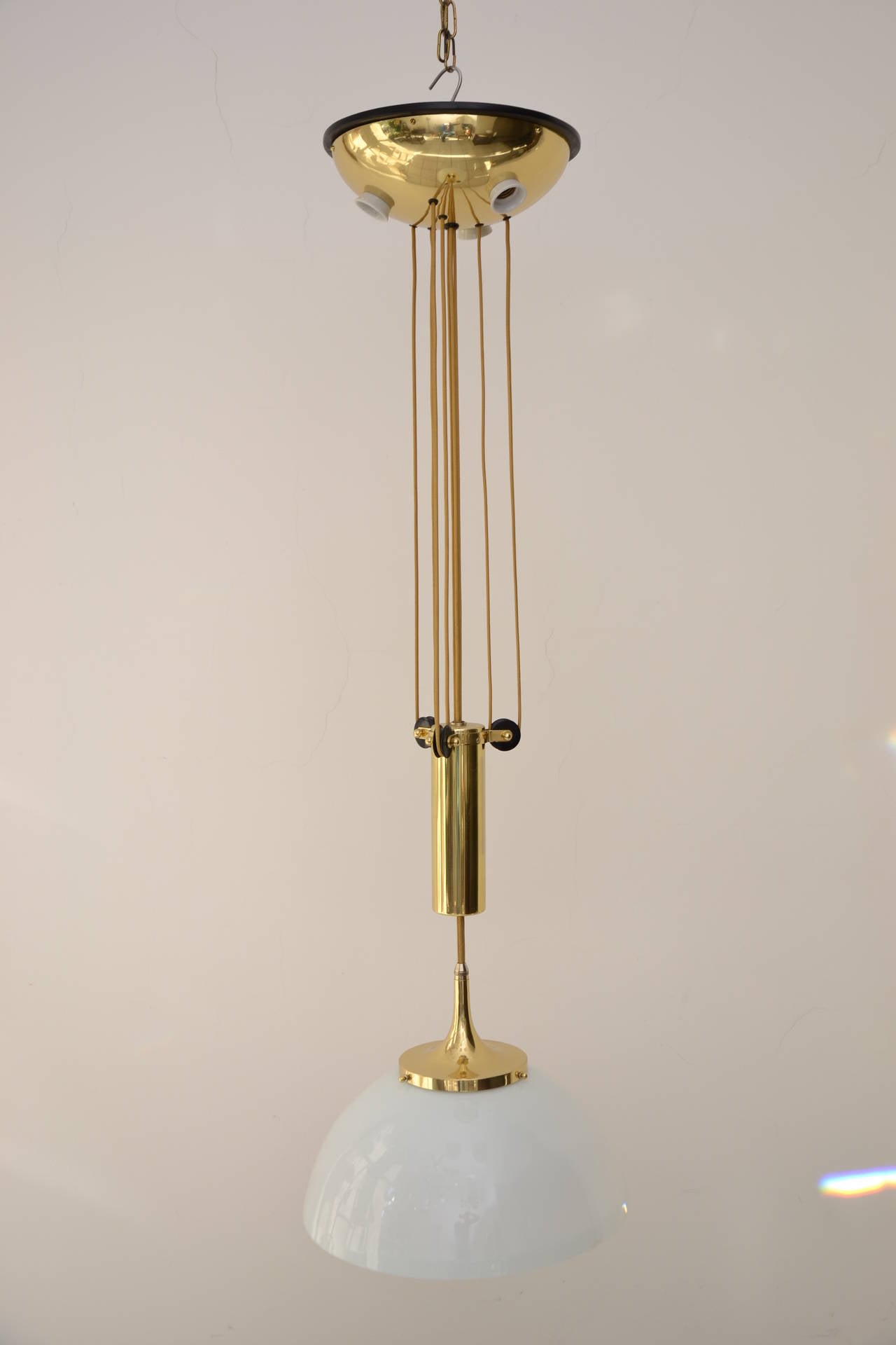 Adjustable chandelier, Vienna, circa 1905.
Brass polished and stove enamelled.