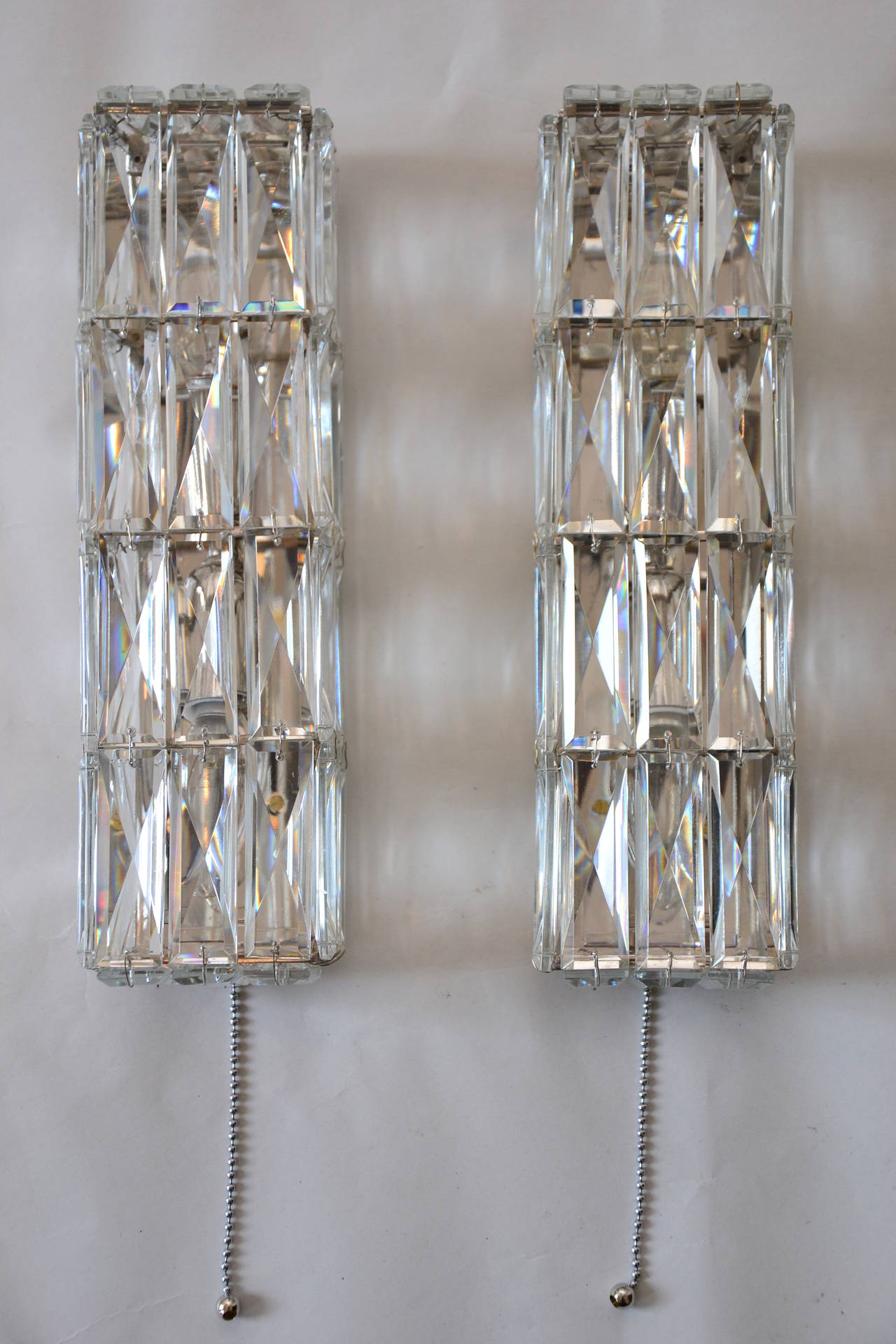 Two nickel-plated crystal glass wall lamp, manufacture Bakalowits, Vienna, 1950. Handmade, covered with beautiful square faceted crystals,
Original condition.