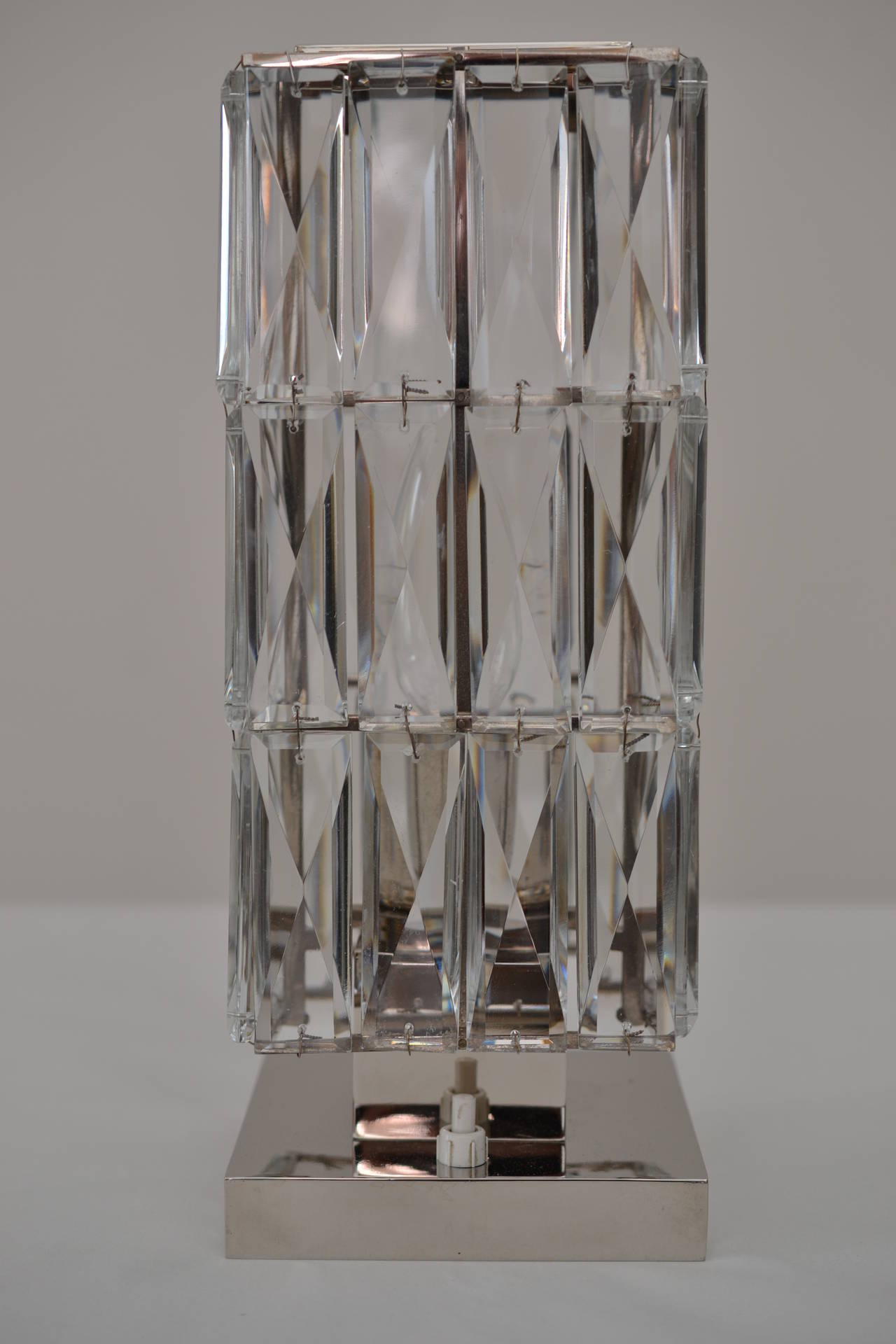 Crystal glass table lamp manufactured by Bakalowits, Vienna, 1950.
Brass nickel-plated.