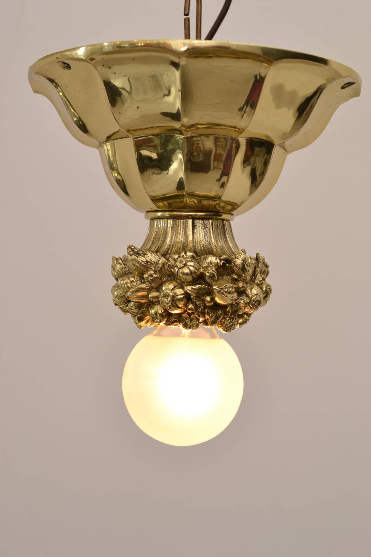 Massive brass ceiling lamp
polished and stove enamelled