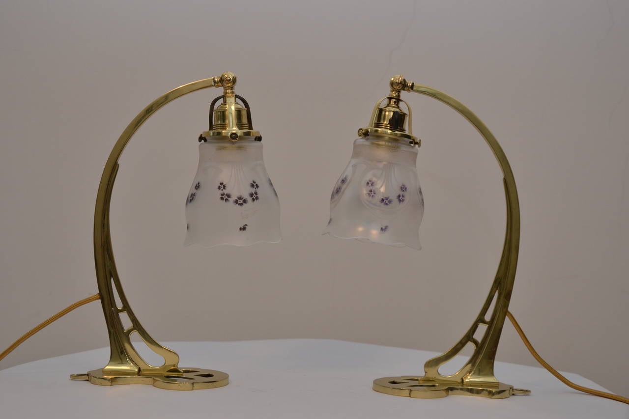 a pair of table lamps with hand-painted original glass shade
brass, polished and stove enamelled