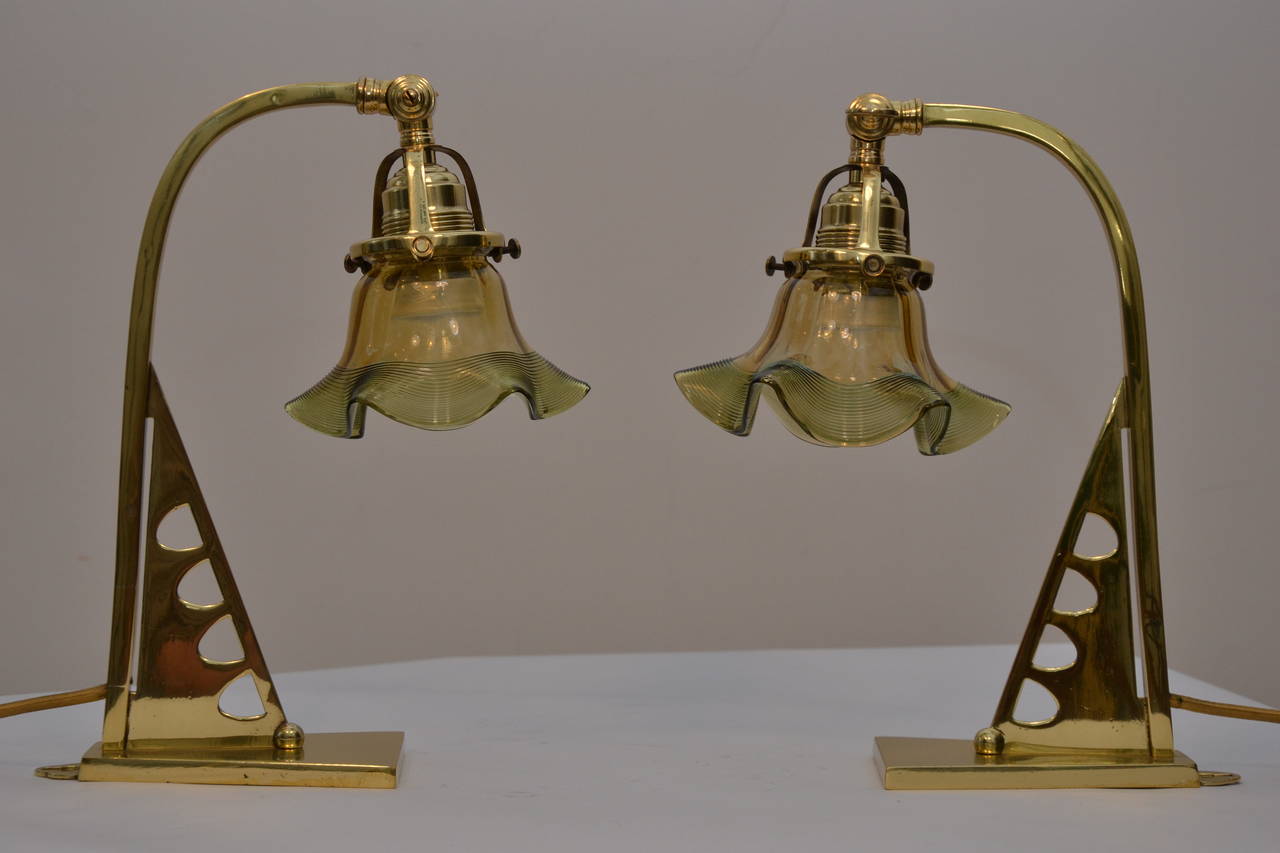 A pair of table lamps with opaline glass shade
polished and stove enameled.
