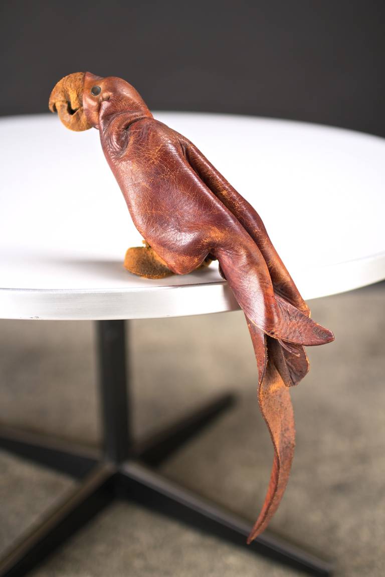 A delightful and expressive papagei ingeniously formed from crimped, pinched, cut and riveted natural leather.

For competitive delivery quotes and a variety of delivery options and services, ask our in-house shipping department.