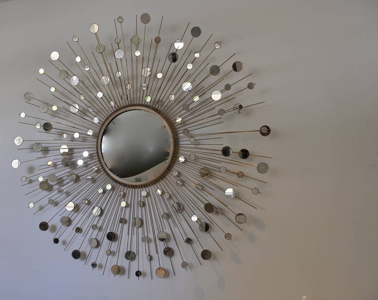 Stunning constellation mirror by Thomas Pheasant for Baker Furniture Company. 

Breathtaking Italian craftsmanship. 

Each brass arm is individually applied and then fit with antiqued mirrored disks to create an illuminating constellation