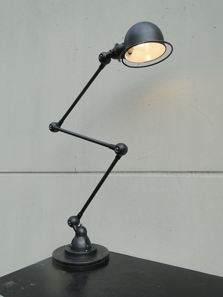 Three-armed French Industrial Jielde lamp.

Designed by Jean-Louis Domecq in the 1950s.

This outstanding lamp was restored and graphite polished very carefully.

Three arms each 15.7" / 40cm.

Total height adjustable to