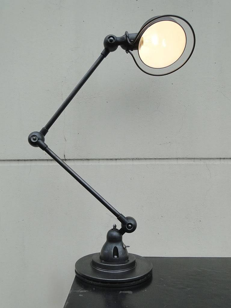 Two-armed French industrial Jielde lamp
designed in the 1950s by Jean-Louis Domecq in the 1950s
This outstanding lamp was restored and graphite polished very carefully
Measures: Two arms each 15.7