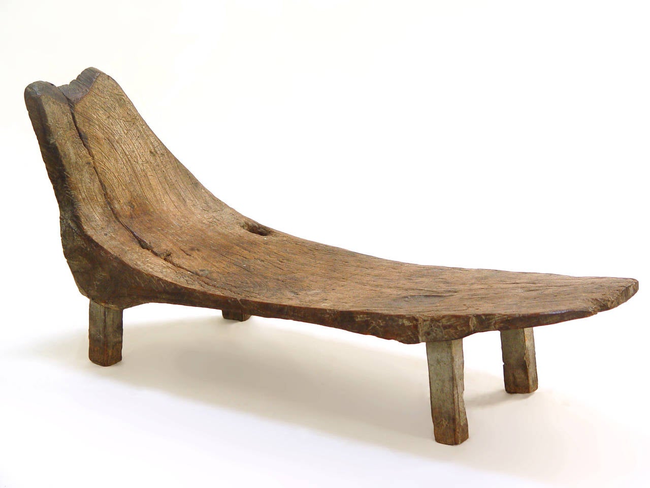 Primitive shoe bench, carved out of a solid piece of teak wood, with fine patina from Indonesia, mid-20th century.