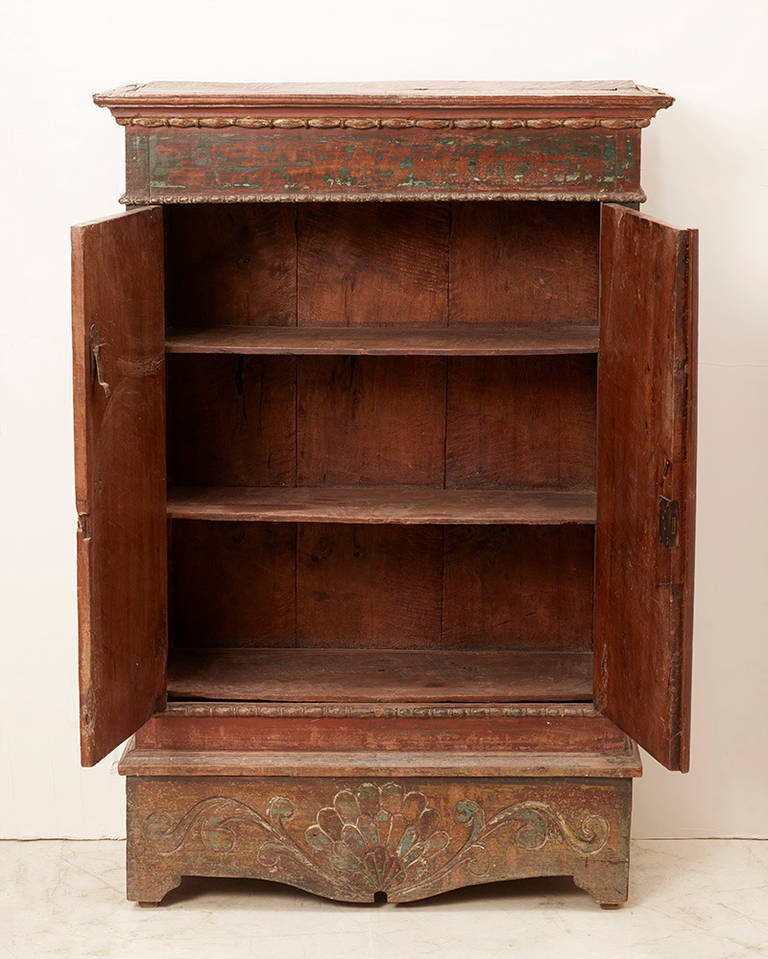 Old painted hand-carved Dutch colonial cabinet from Indonesia.
Two original shelves are supplied.
In a great shape.