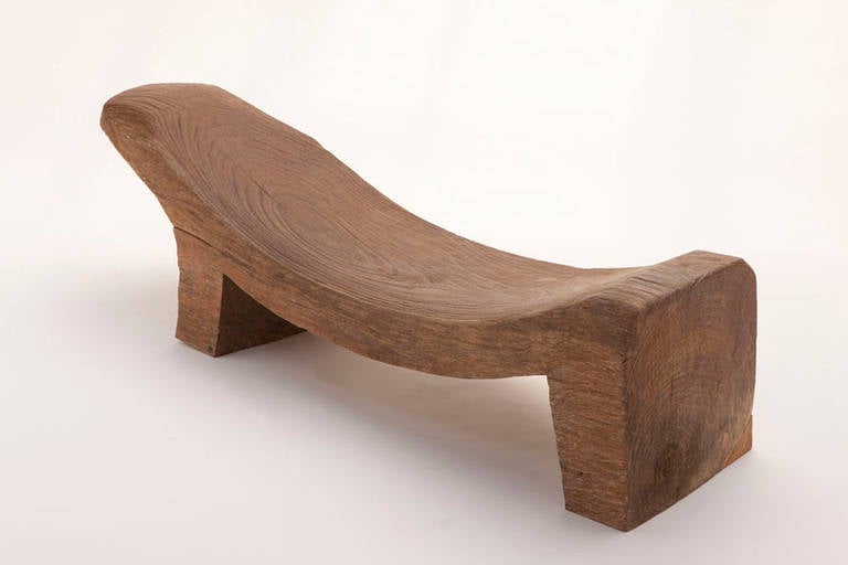 Primitive, solid teak bench in a minimal animal form. Fine patina, from Java, early-mid 20th century.