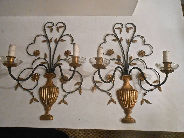 Two lights, black metal, gold leaf gilded urns leaves and flowers