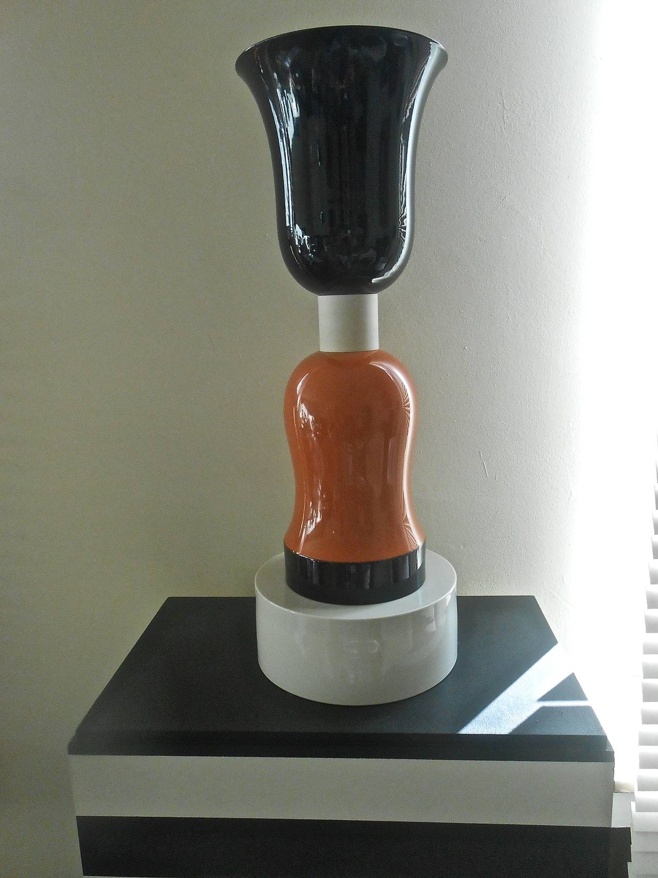 Vase TOTEM, combination of white porcelain biscuit and two different colors enameled porcelain.
Produced and stamped by the manufacture de Sèvres in 1994.
Signed by E. Sottsass under the base.

                