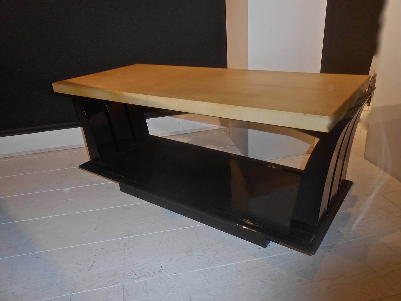 Black laquered with parchment-covered table top.
Stamped Majorelle Nancy.
Circa 1930.